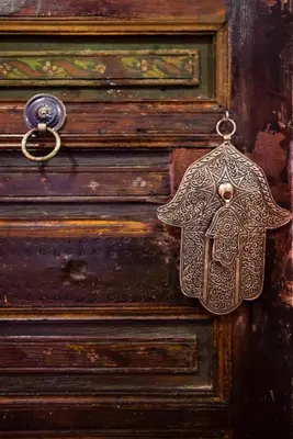 a wooden door with an elephant shaped object on it at dar annee in Fès