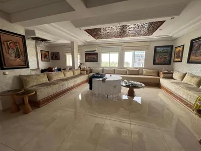 a large living room with couches and a table at Galaxy appartement MEKNES in Meknès
