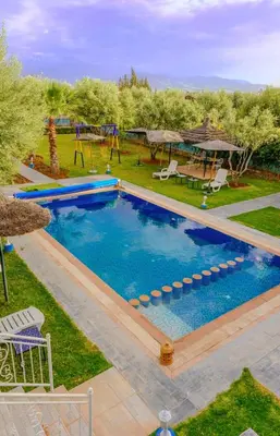 an overhead view of a swimming pool with a playground at Villa de Luxe à Marrakech avec Piscine Chauffée Privée in Aghmat