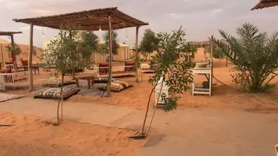 a picnic area in the middle of a desert at Desert luxury in Hassilabied