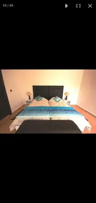 a bedroom with a bed with two pillows on it at Villa athis in Fourou