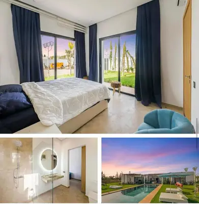 a bedroom with a bed and a large window at Villa solea in Marrakech