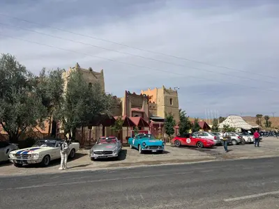 a group of cars parked on the side of a street at Kasbah Dounia in Kerrando