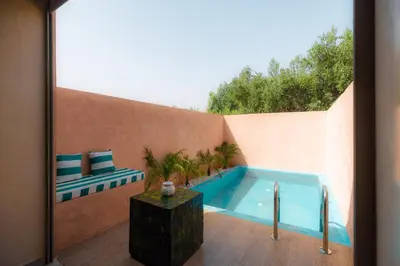 a swimming pool in the backyard of a house at Villa Stevana in Oulad Mazoug
