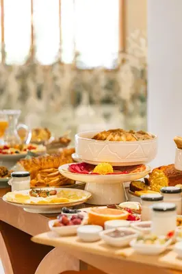 a table filled with plates of food on a table at Villa Stevana in Oulad Mazoug