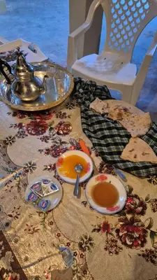 a table with a plate of food and a tea kettle at Gite d'tape handour in Hamdour