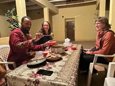 a group of three people sitting around a table at Gite d'tape handour in Hamdour