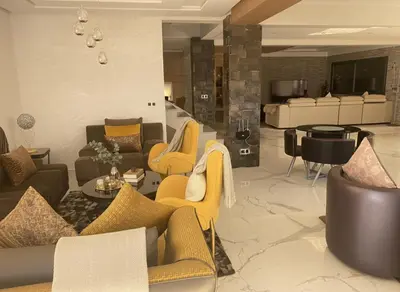 a lobby with couches and chairs and a piano at Villa Lumiere-Luxury Retreat with Private Spa and Garden in Ifrane