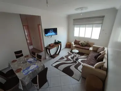 a living room with a couch and a table at Appart prés du chu fes fes shore in Fès