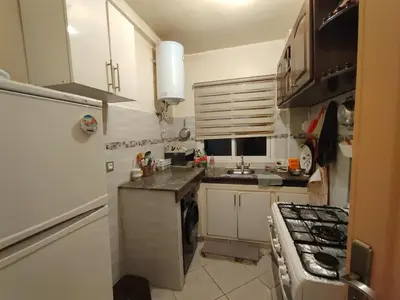 a small kitchen with a sink and a stove at Appart prés du chu fes fes shore in Fès