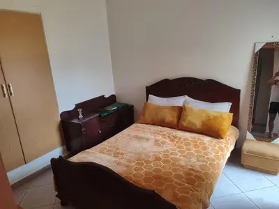 a bedroom with a bed with two pillows on it at Appart prés du chu fes fes shore in Fès