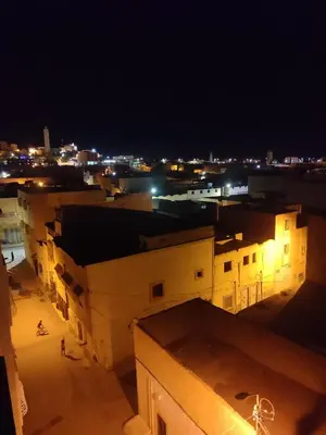 a view of a city at night with buildings at Relaxnstay midelt in Midelt