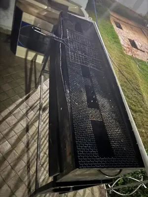 a metal sign with the letter l on it at Ferme Erraha in Bhalil