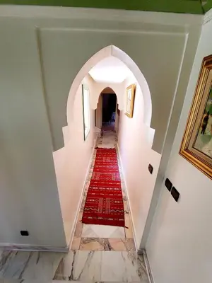 a hallway with a red carpet on the floor at Marrakech LUXE in Oulad Akkou