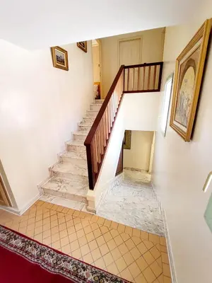 a staircase in a house with a tile floor at Marrakech LUXE in Oulad Akkou