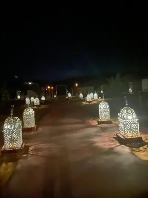 a group of lights in a parking lot at night at Merzouga in Merdani
