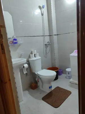 a small bathroom with a toilet and a sink at Relaxnstay in Midelt
