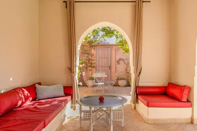 a living room with a couch and a table at Villa Cannella - Marrakech in Chaibate