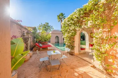 an outdoor patio with a table and chairs at Villa Cannella - Marrakech in Chaibate