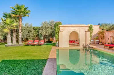 a house with a swimming pool in a yard at Villa Cannella - Marrakech in Chaibate
