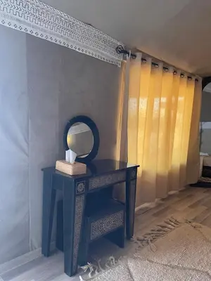 a blue dressing table with a mirror on it at Luxury Desertcamp in Merdani