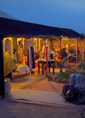 a group of people sitting under a tent at Desertwhispercamp in Merzouga
