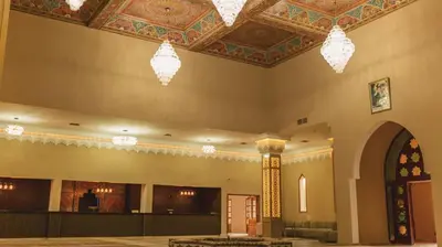 a large room with a ceiling with chandeliers at Hôtel Reda Zagora in Zagora