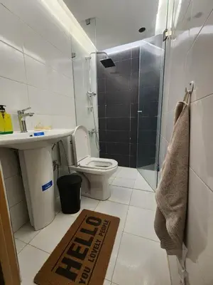 a bathroom with a toilet and a sink and a shower at Villa Paradis Fès