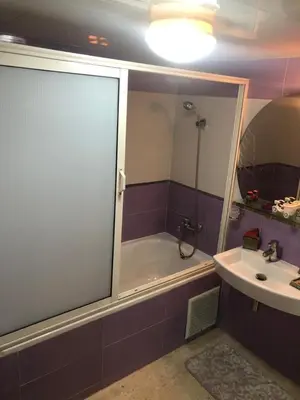 a bathroom with a bath tub and a sink at Nas fez in Fès