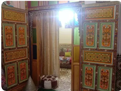 an open door to a room with a bedroom at Maison Soulaîmi in Fès