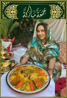 a woman is holding a plate of food at Maison Soulaîmi in Fès