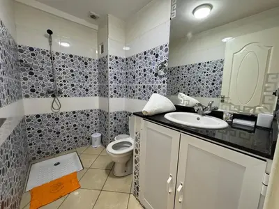 a bathroom with a sink and a toilet at Dana in Beni Mellal