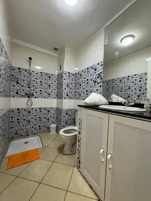 a bathroom with a toilet and a sink at Dana in Beni Mellal
