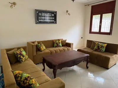 a living room with two couches and a coffee table at Apartment in downtown Fez in Fès