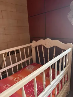 a crib in a room with at Apartment in downtown Fez in Fès