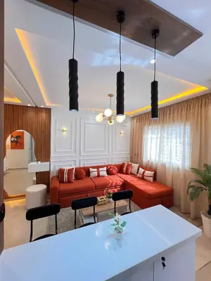a living room with a couch and a table at Dream apartment in Meknès