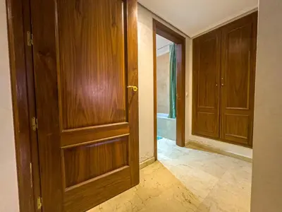 an empty room with an open wooden door at Gueliz 2-BR Apt Majorelle Garden Spacious Terrace in Oulad Akkou