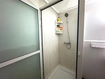 a shower with a glass door in a bathroom at Gueliz 2-BR Apt Majorelle Garden Spacious Terrace in Oulad Akkou