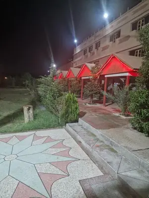 a building with a star painted on the ground at night at Café restaurant in Issafene