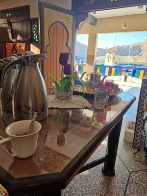 a table with a tea kettle on top of it at Café restaurant in Issafene