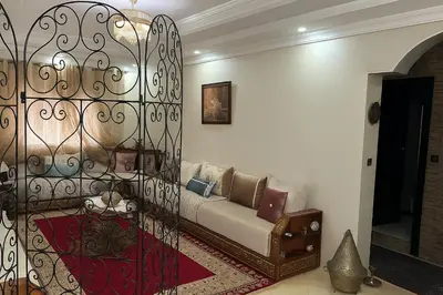 a living room with a couch in a room at Appart familial moderne de luxe Location journalière ou longue durée in Khemisset