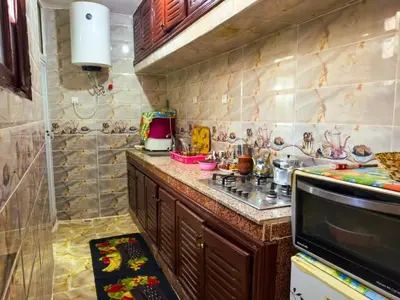 a kitchen with a counter top and a sink at vintage in Fès