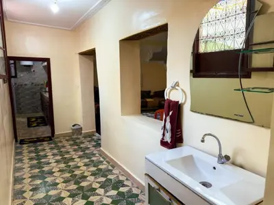 a bathroom with a sink and a mirror at vintage in Fès