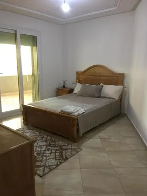 a bedroom with a large bed in a room at appartement tanger in Oulad Akkou