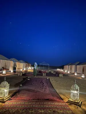 a tent in a desert at night at Desert Mhamid in Mhamid
