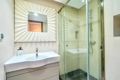 a bathroom with a sink and a shower at Luxueux appartement à Prestigia avec Wifi Fibre 100Mo in Fès