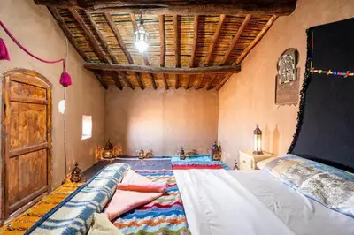 a large bedroom with a large bed in a room at Casa de las Estrellas in Mhamid