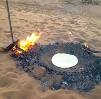 a white frisbee is on fire on the beach at Casa de las Estrellas in Mhamid