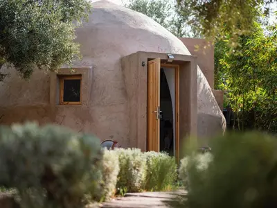 an outside view of a home with a dome at Villa Roswell with Pool Privatisation in Heddad