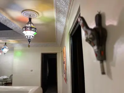 a chandelier hanging from a ceiling in a room at Riad Dar Mama Laila in Fès